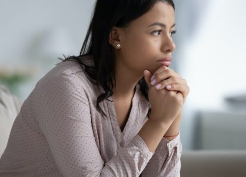 Young woman concerned about cancer symptoms