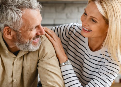 Older man talking to a younger woman